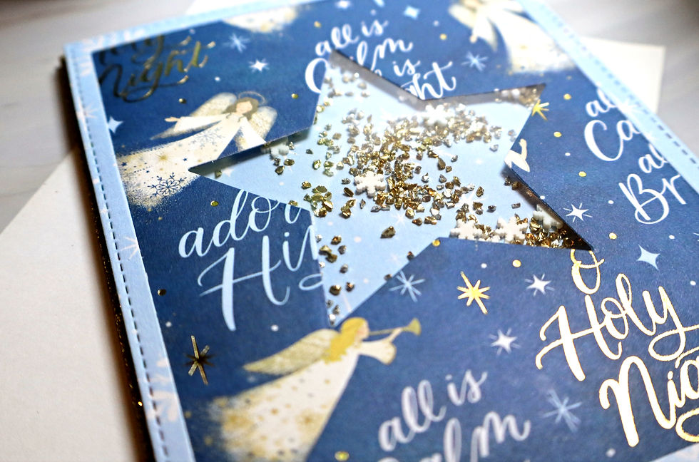 Eye-level view of a crafting table with handmade greeting card supplies and a partially completed card