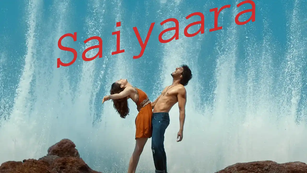 Two people pose dramatically by a waterfall, one wearing an orange dress. The word "Saiyaara" is in bold red text above them.