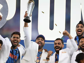 : A group of Indian cricket team players celebrating their victory in the 2025 ICC Champions Trophy. The captain is holding the trophy high, while the team members around him cheer with excitement, wearing white blazers and medals. The background features a large, illuminated "CHAMPIONS" sign with golden confetti falling.