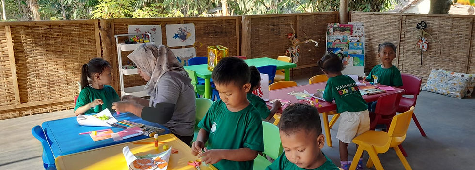 Children doing art at a nature based pre school inIndonesia