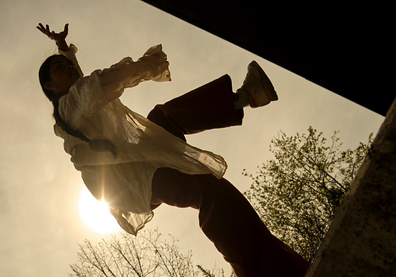 photo of chandenie dancing outside in the sunset