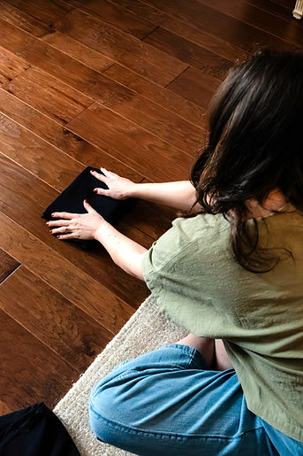 professional organizer folding a pair of pants