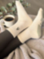 Buttery yellow Make It Dirty Pilates grip socks with olive grip and tonal embroidery