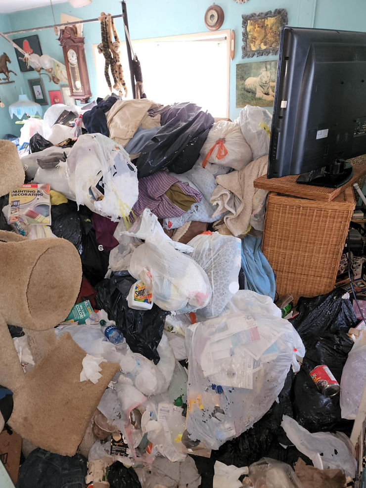 Wide angle view of a cluttered room filled with items
