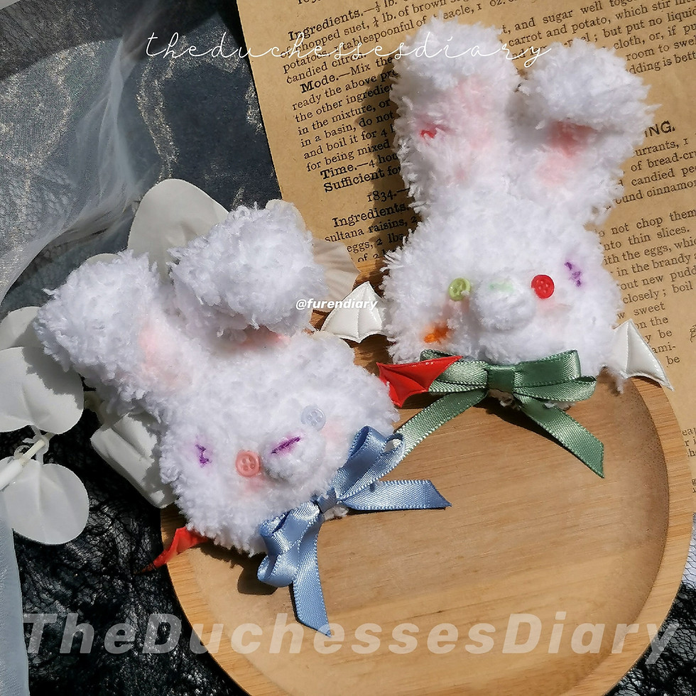 Bunny Brooches which have button eyes specifically designed to match the Halloween season