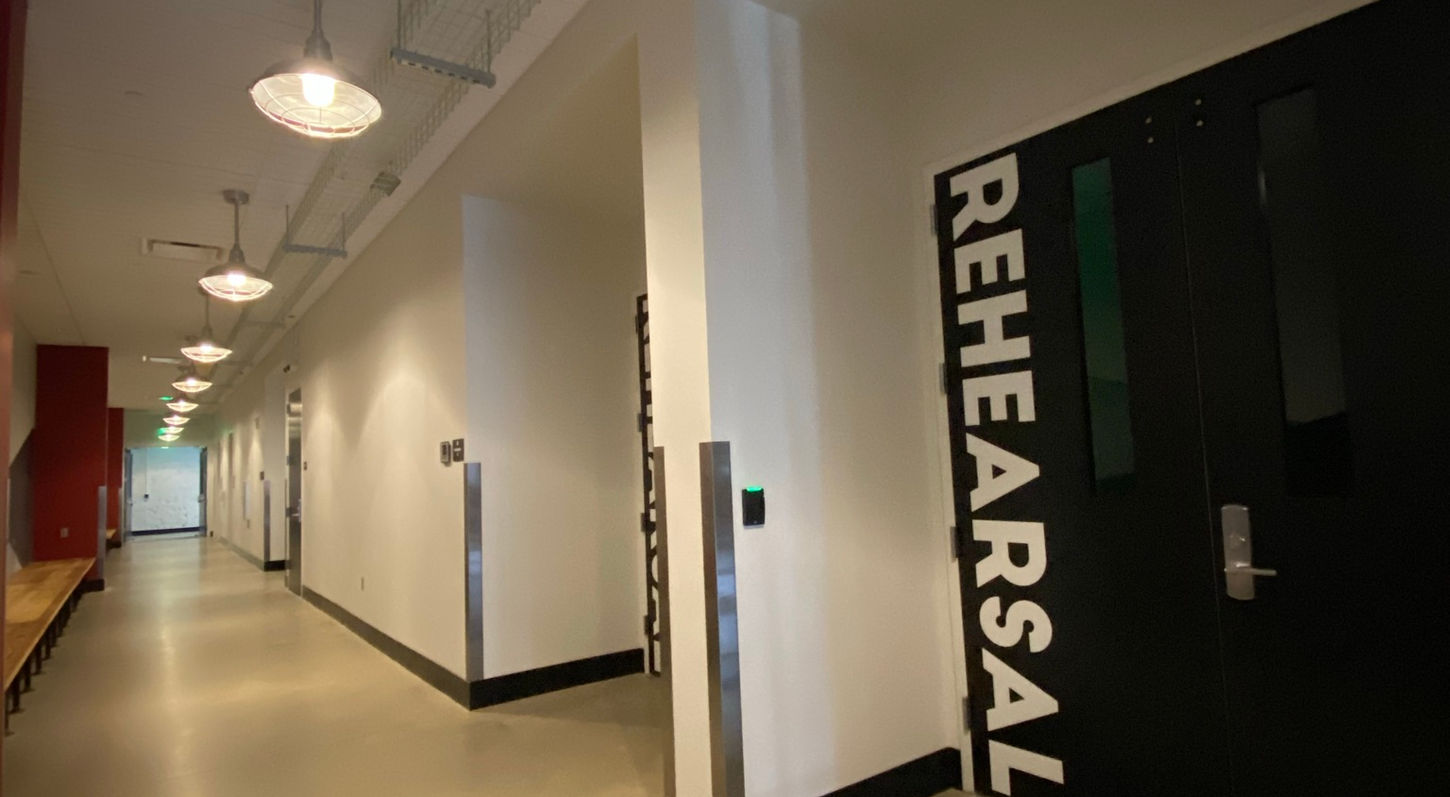 An interior view of the connecting hallway between the Rehearsal Suite and the rest of the Red Mountain Theatre campus.