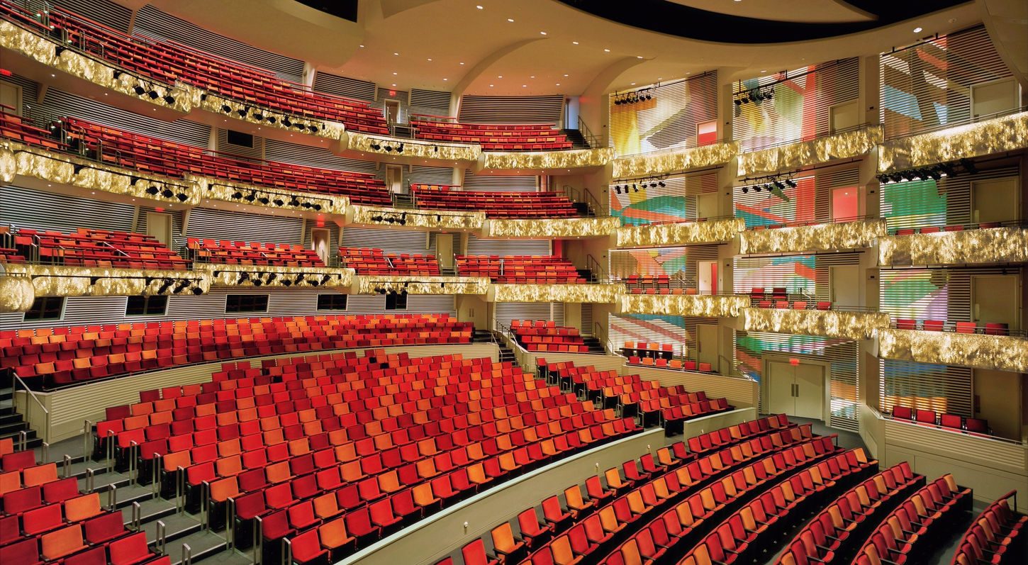 An interior view of Muriel Kauffman Theatre at the Kauffman Center for the Performing Arts. Looking from Balcony Right towards the audience. The auditorium is empty, and the LED balcony fronts are on display.