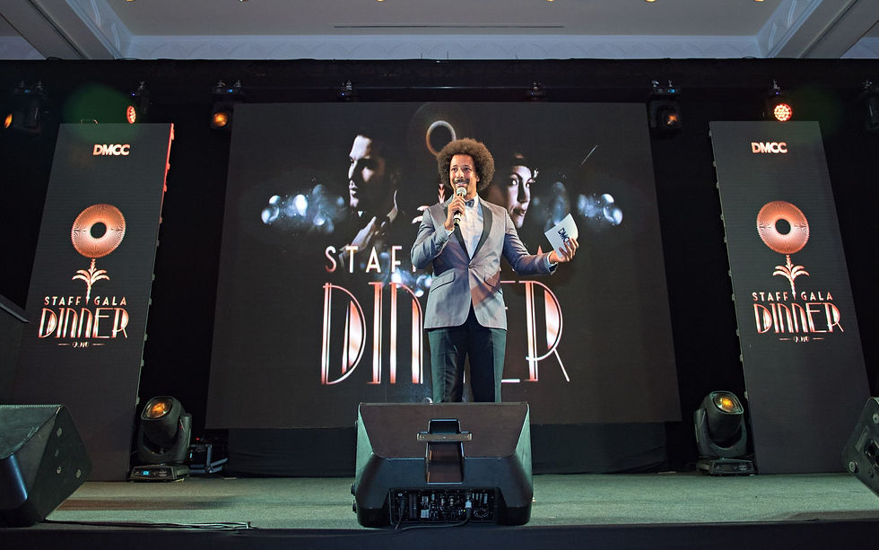 Flo Akinbiyi On Stage As A Presenter At A Gala Dinner