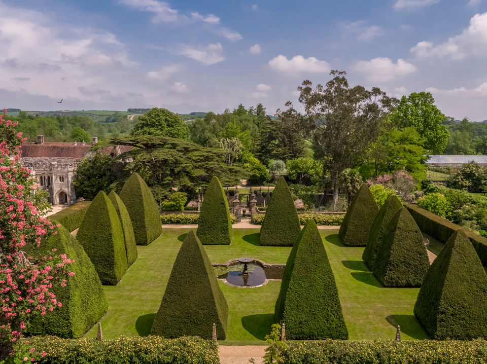 A view over the formal gardens that are open to the public at Athelhampton in Dorset