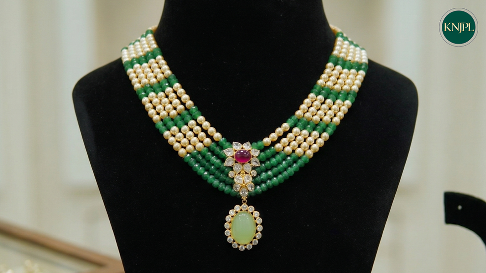 Lightweight gold layered necklace with pearl and green beads, ruby center motif, and oval green pendant – elegant fast-selling jewellery design for retailers and wholesalers