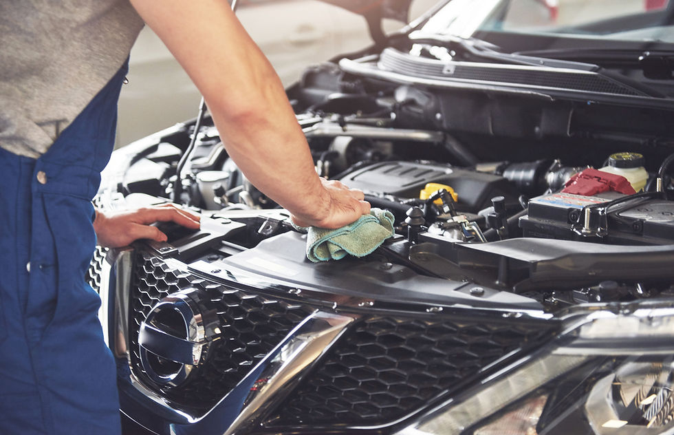 muscular-car-service-worker-repairing-vehicle.jpg