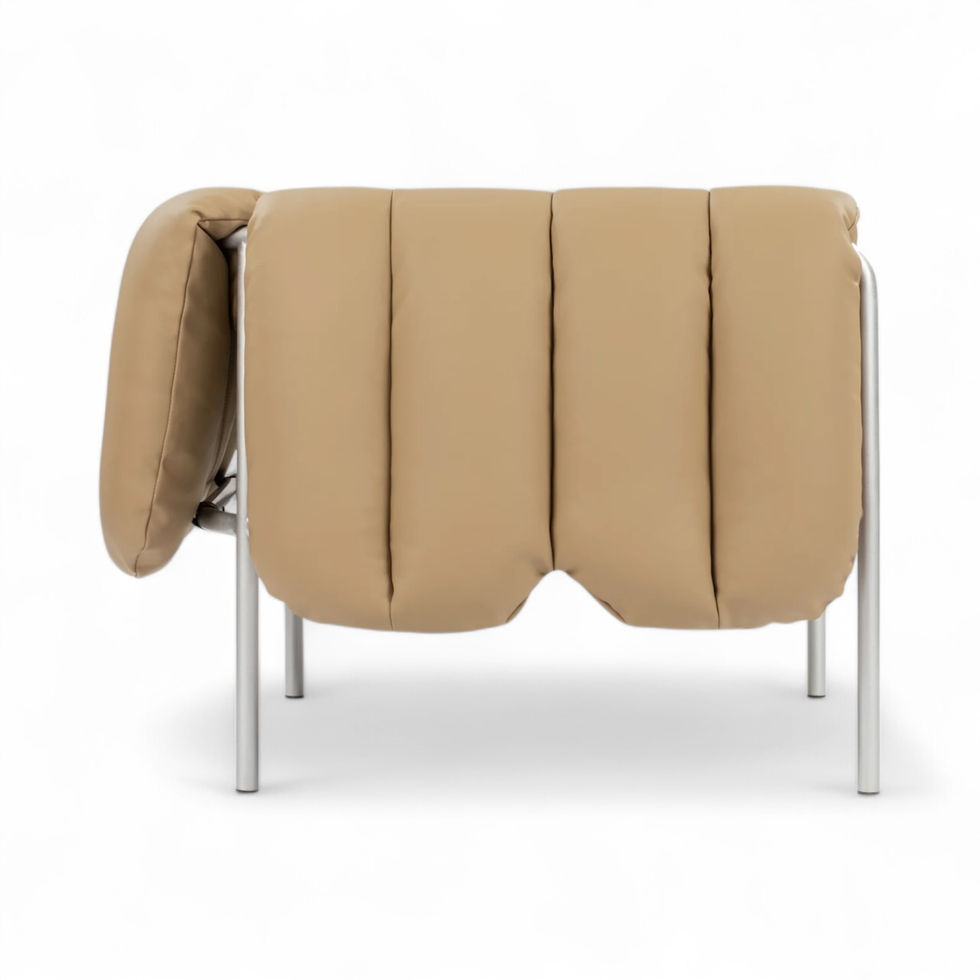 Tan tufted chair with silver legs