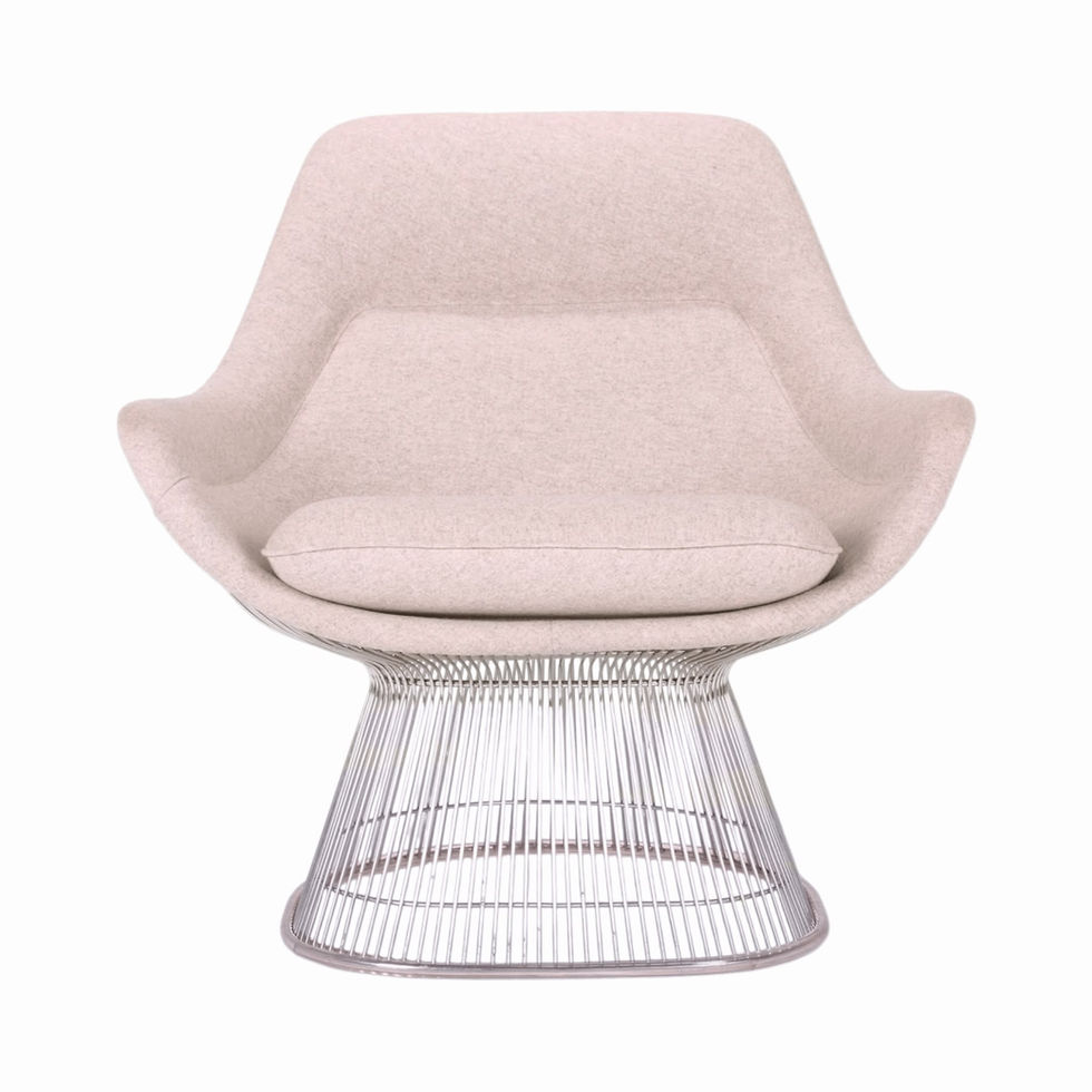 Beige upholstered armchair with a chrome wire base