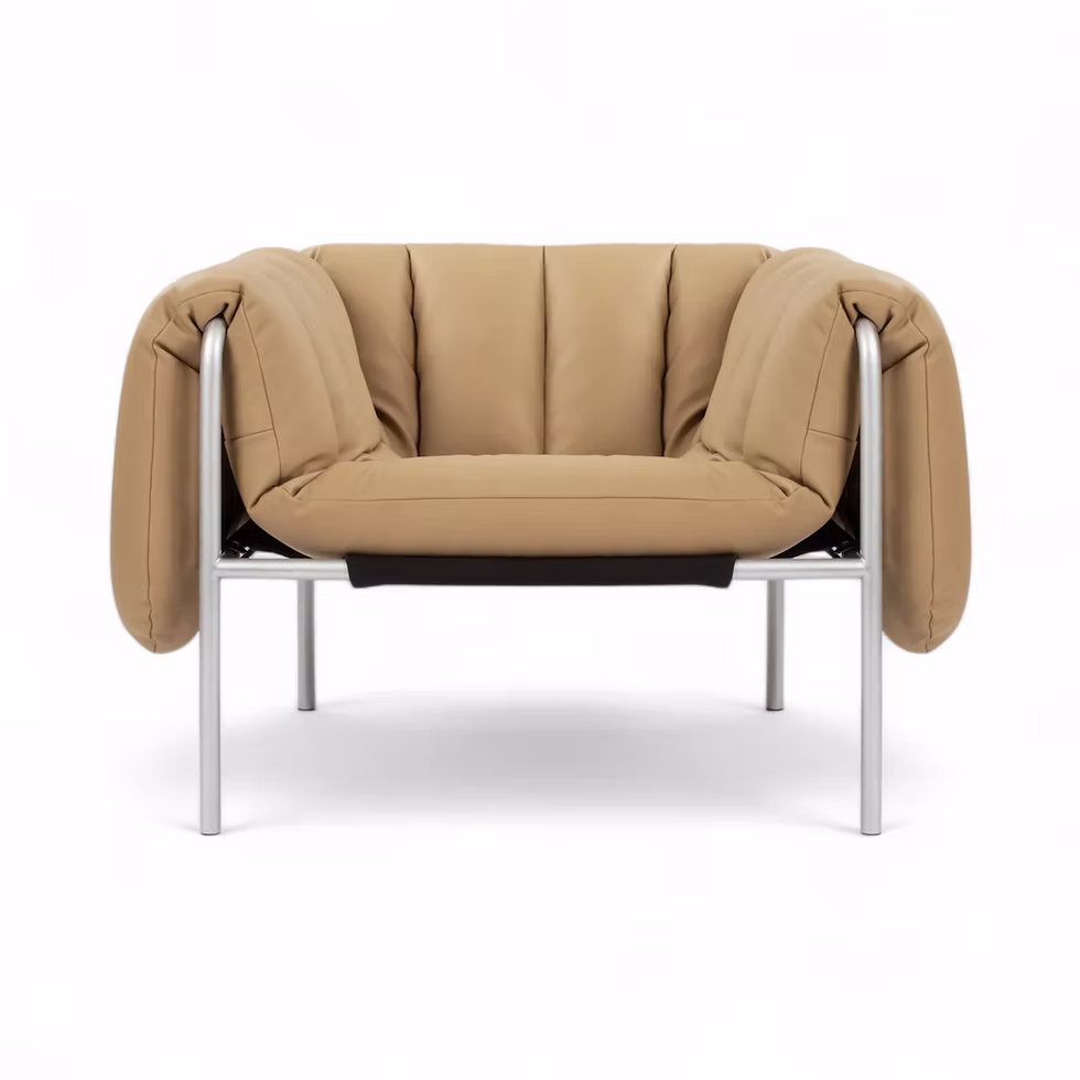 Tan leather armchair with a metal frame
