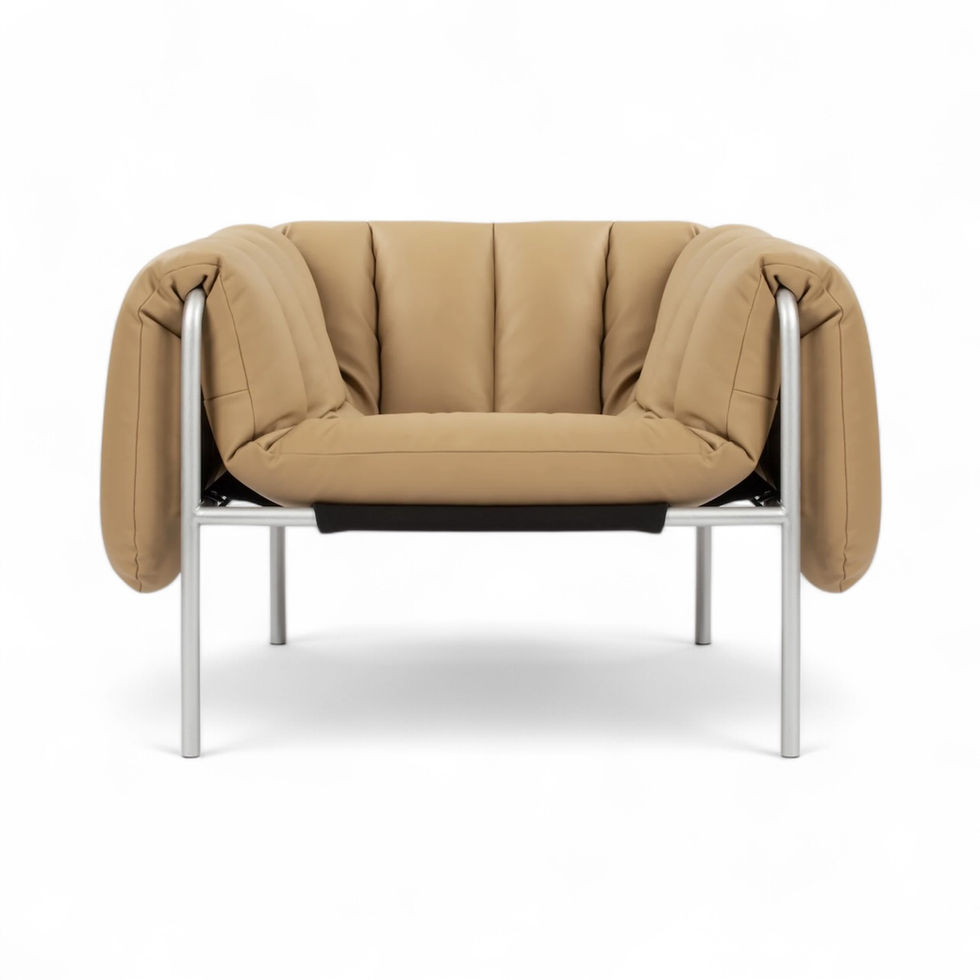 Tan leather armchair with a metal frame
