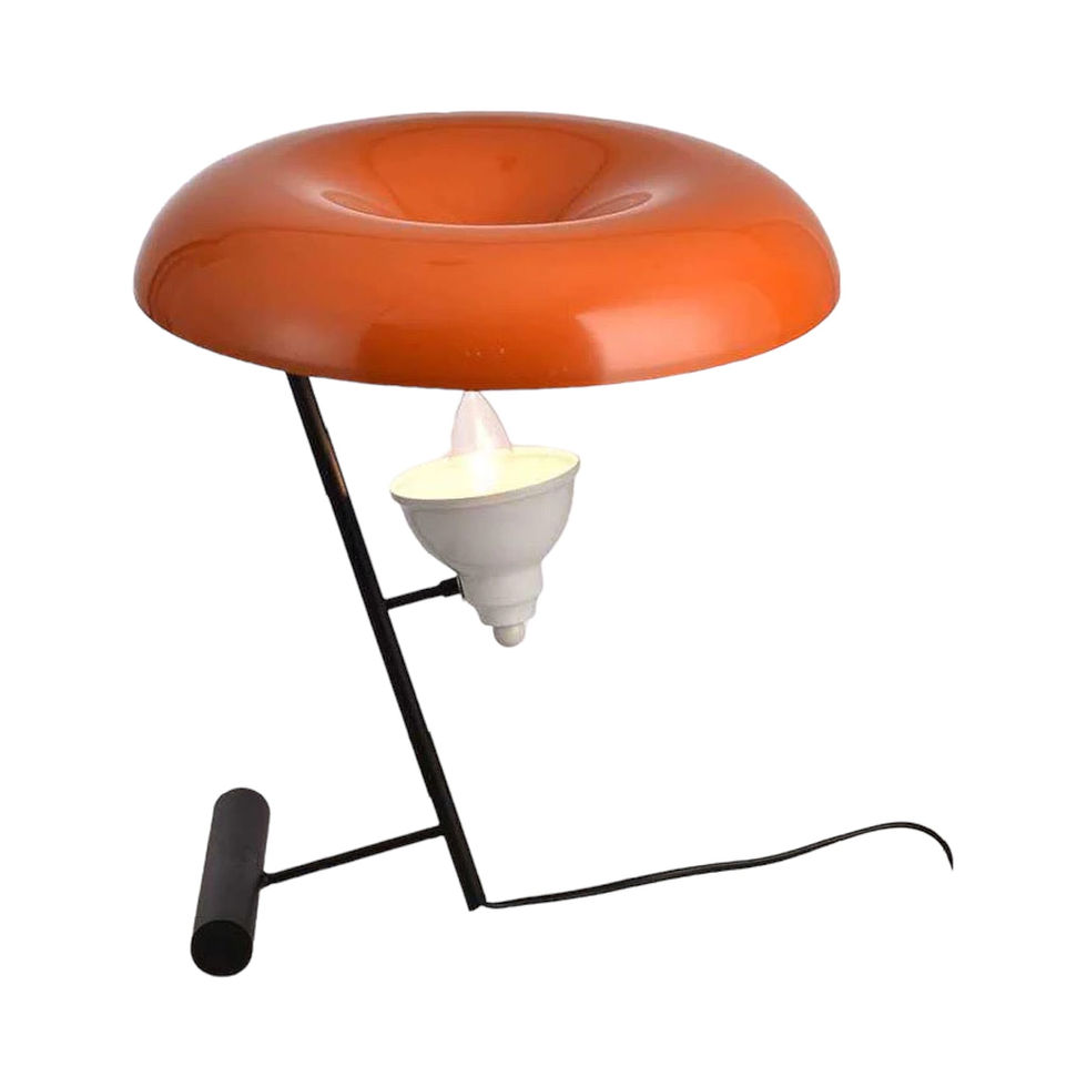 Orange Theia Floor Lamp with black stand and unique lighting design.