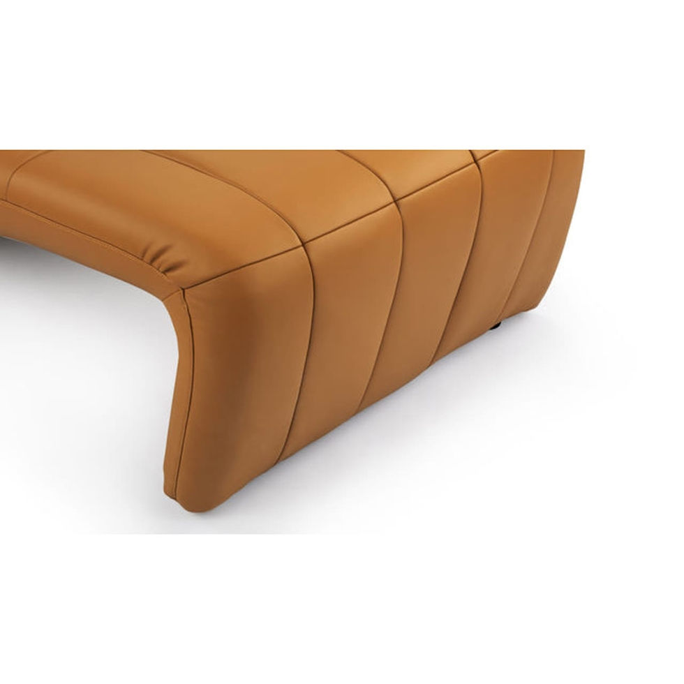 Close-up of a tan leather Nue Modern sofa with cushioned design detail.