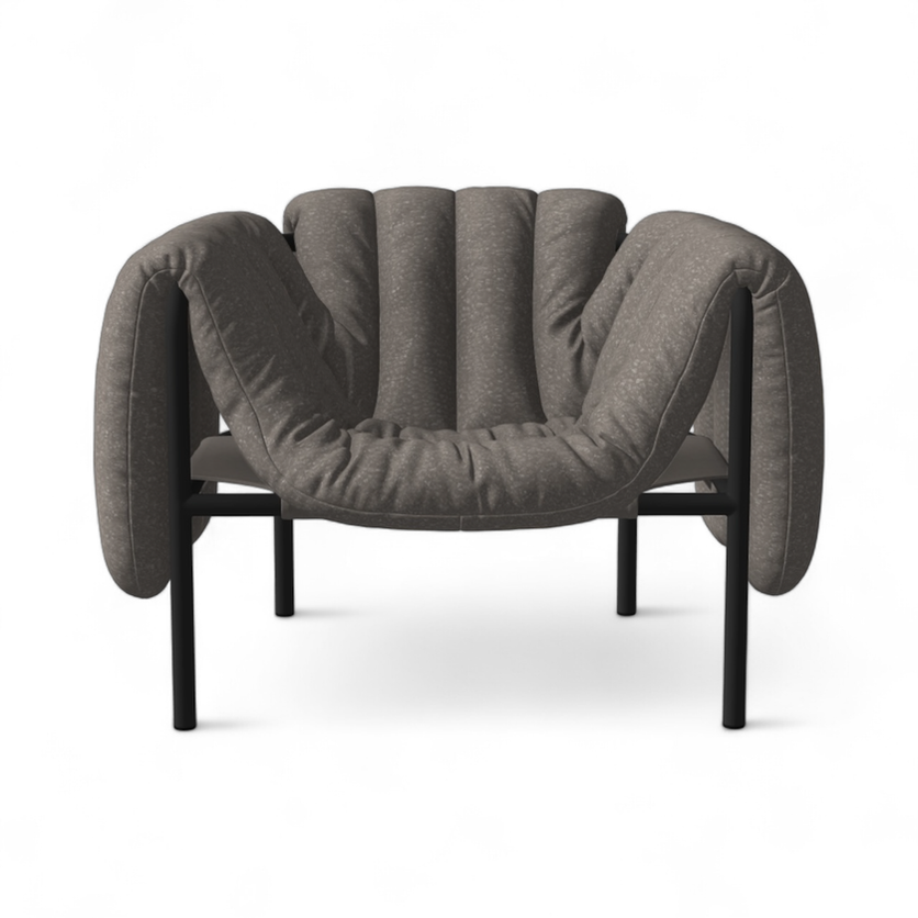 Gray upholstered armchair with black metal legs, a unique design