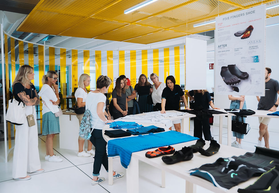 A group of attendees are given a glimpse into UYN's design process on a tour of the new AREAS centre