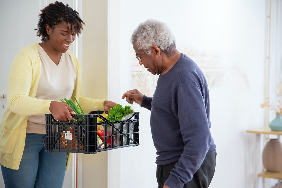 Carer helping old male with groceries