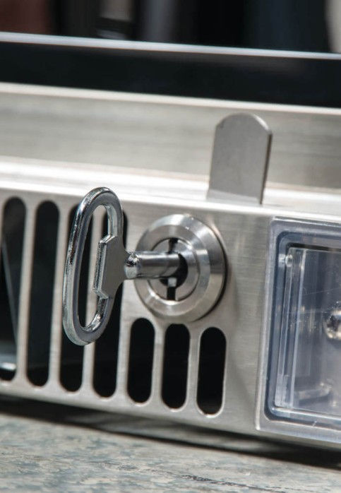 metal key in a fridge keyhole