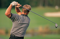 Golfer Swinging Club