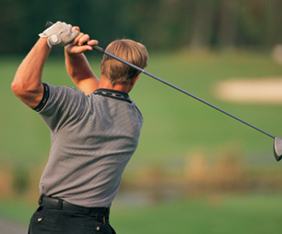 Golfer Swinging Club