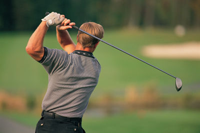 Golfer Swinging Club