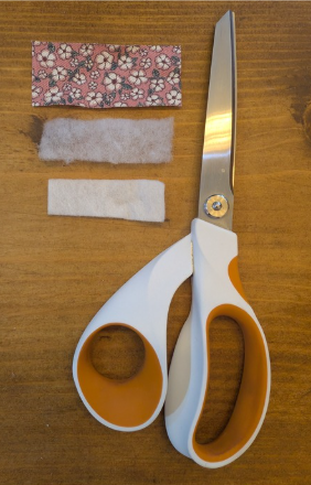 Scissors and strips of fabric laid out