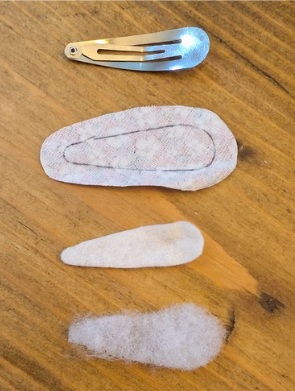 The layers for a fabric hair clip, a metal hair clip, the fabric shape, wadding shape and padding shape