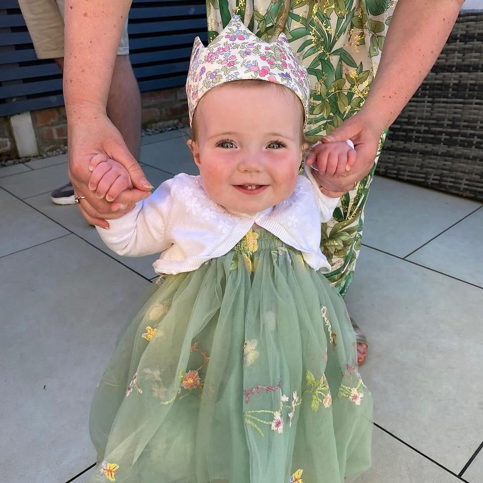 Toddler wearing a party crown in Nancy Ann Liberty London fabric_edited.jpg