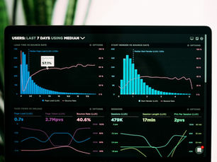 Financial analytics dashboard on a laptop, reflecting EmaraTax cross-checking VAT and corporate tax returns