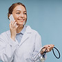 female-doctor-lab-coat-talking-phone.jpg