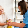 medium-shot-old-woman-nurse-holding-hands.jpg