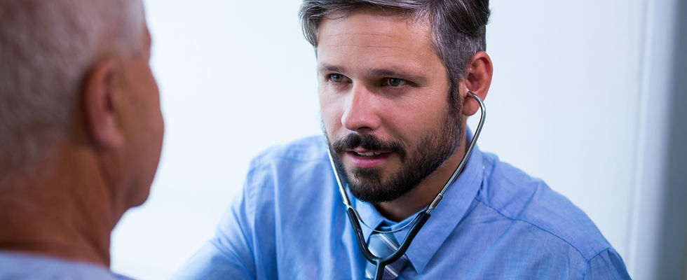 male-doctor-examining-patient (1).jpg