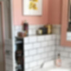 Hidden Storage in Pink Bathroom with White Subway Tiles