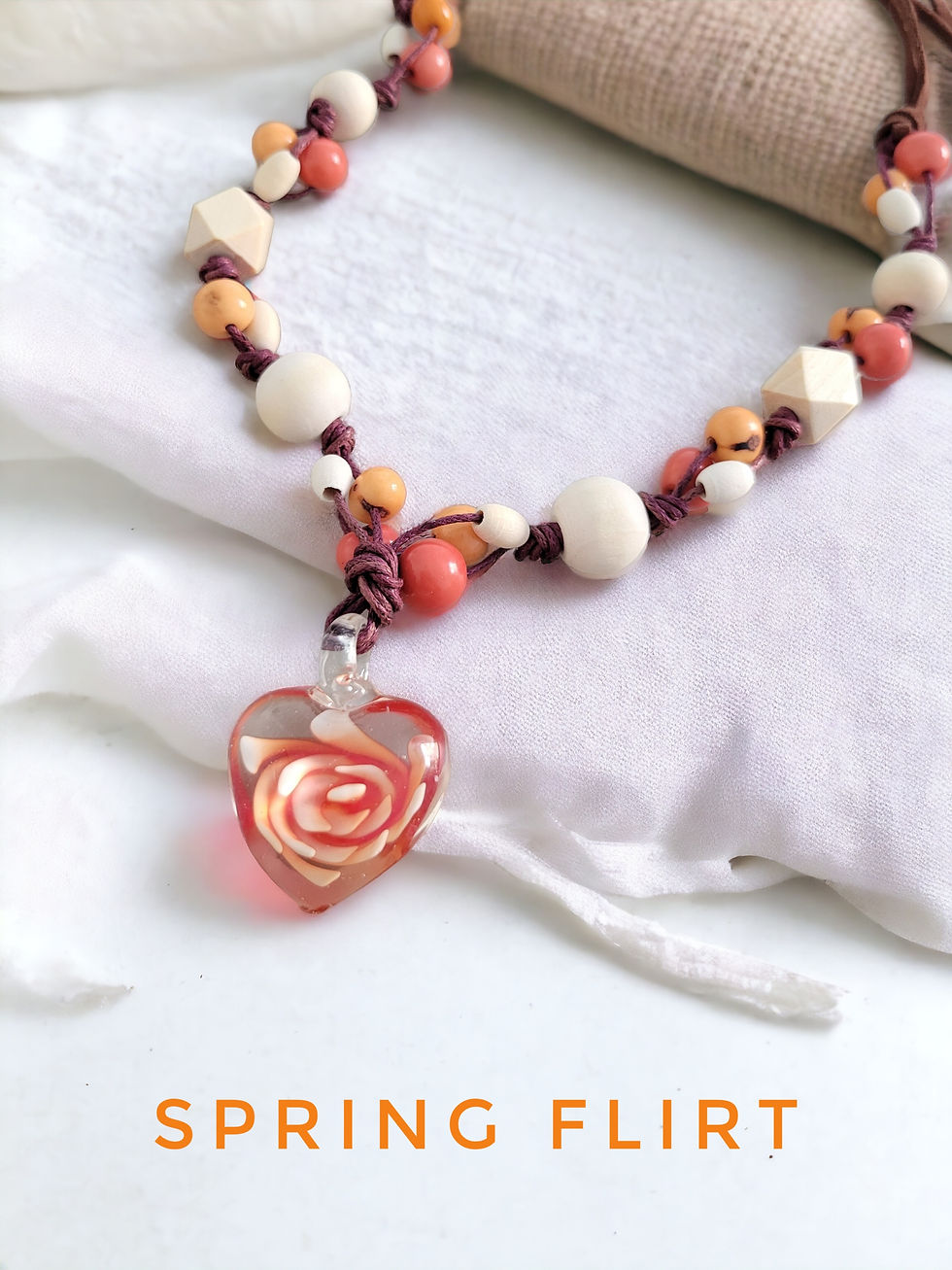 Thumbnail: Spring flirt glass heart and wood acai beaded love necklace