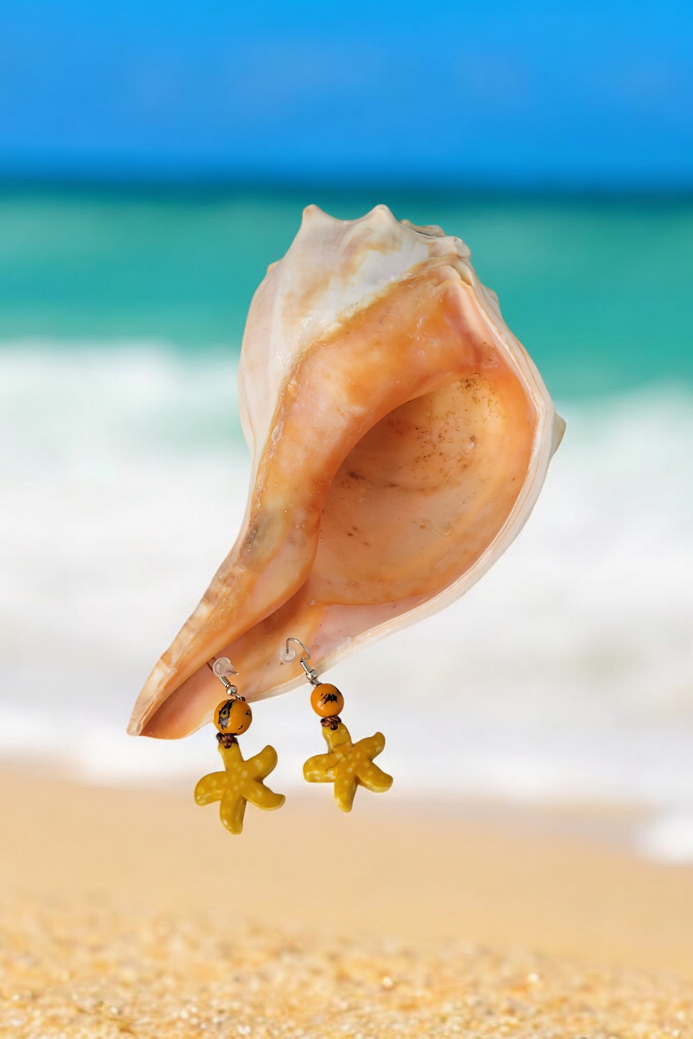Thumbnail: Petite sea star  tagua earrings