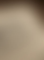 Crumbled paper on a wooden desk with scribbles and "FORGET THIS" written. Nearby pencil and eraser shavings. Mood: frustrated.