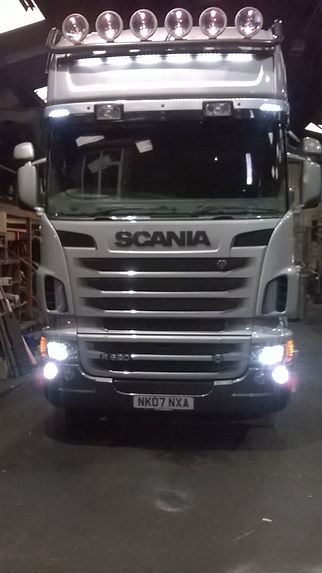 A truck with its headlights on