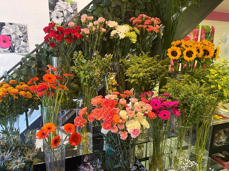 bright and colourful mixture of flowers in a florists