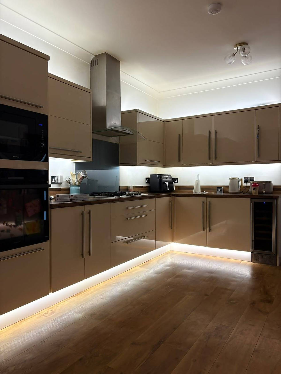 Modern kitchen with recessed lighting installation in progress.