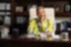 Dr. Jacklyn A. Chisholm sits at her desk.
