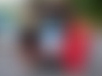 LaVonne (left) helps her client Jateir (right) pick up fans and an air conditioner.