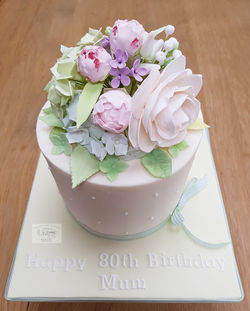80th Birthday cake with sugar flower bouquet