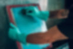 male worker cleaning a screen