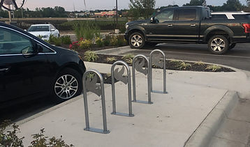 Bent metal tube made by KC Weld & Fab thats used as a bike rack