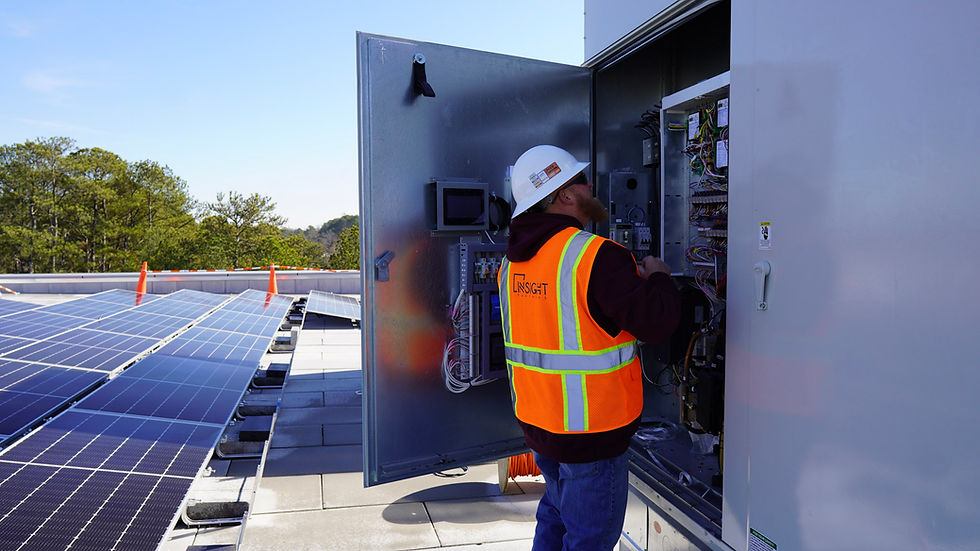 Insight Partners Controls Team programming an AAON HVAC unit on a commercial rooftop in Georgia