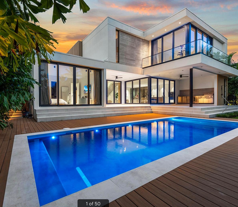Freshly installed fiberglass swimming pool in a modern backyard by Pool Lady