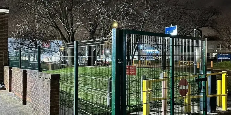 Security fencing around a commercial property at night, preventing trespassing and antisocial behaviour